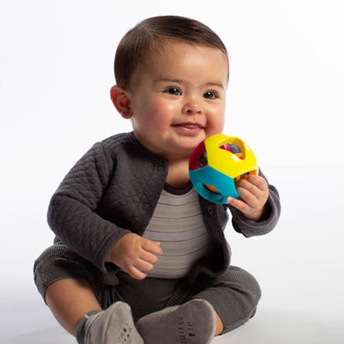 Infant holding a toy